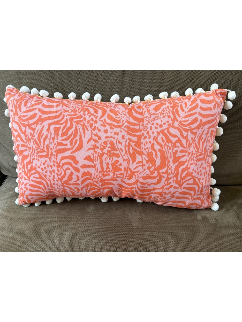 Bright and Fun Lilly Pulitzer pillow w/white pompoms. Size is 11.5 X 9 inches.